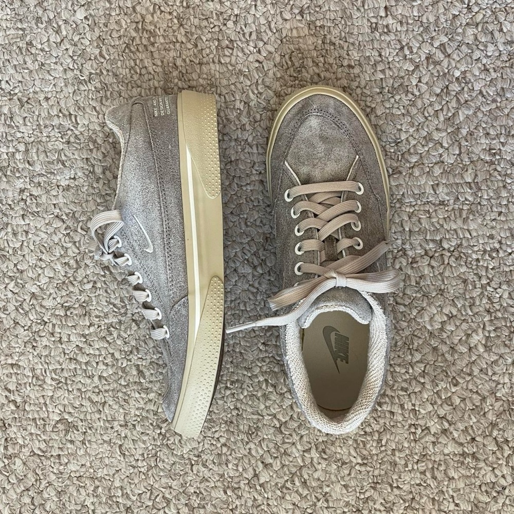 grey suede Nike sneakers